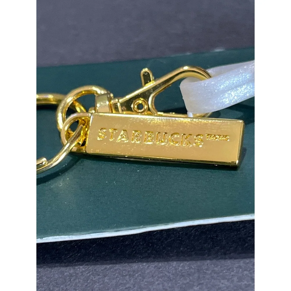Starbucks 2024 Reusable Hot Cup Lid Stopper Keychain White Pearl Star Charm
